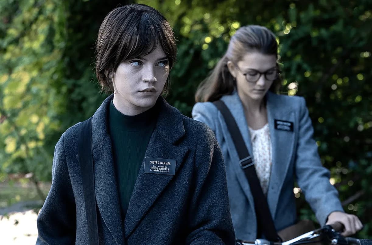 Sophie Thatcher and Chloe East as Sister Barnes and Sister Paxton in Heretic, wearing missionary name tags