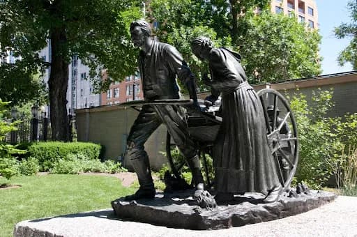 Pioneer statue representing early Mormon settlers and the Law of Consecration