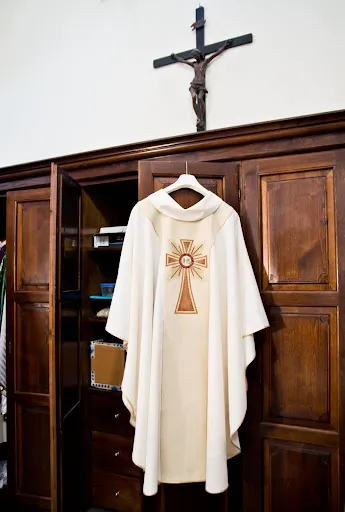 Religious clothing including temple garments, Catholic vestments, Islamic hijab, and Hindu sari symbolizing modesty and spiritual commitment